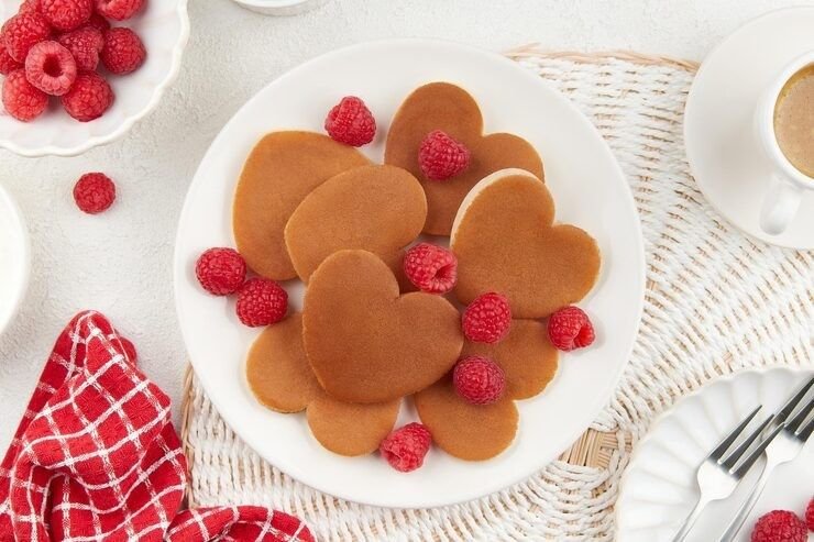 heart shaped pancakes with berries