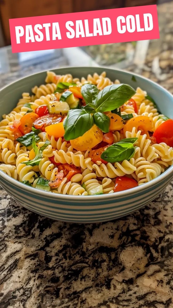 A bowl of fresh pasta salad with colorful vegetables