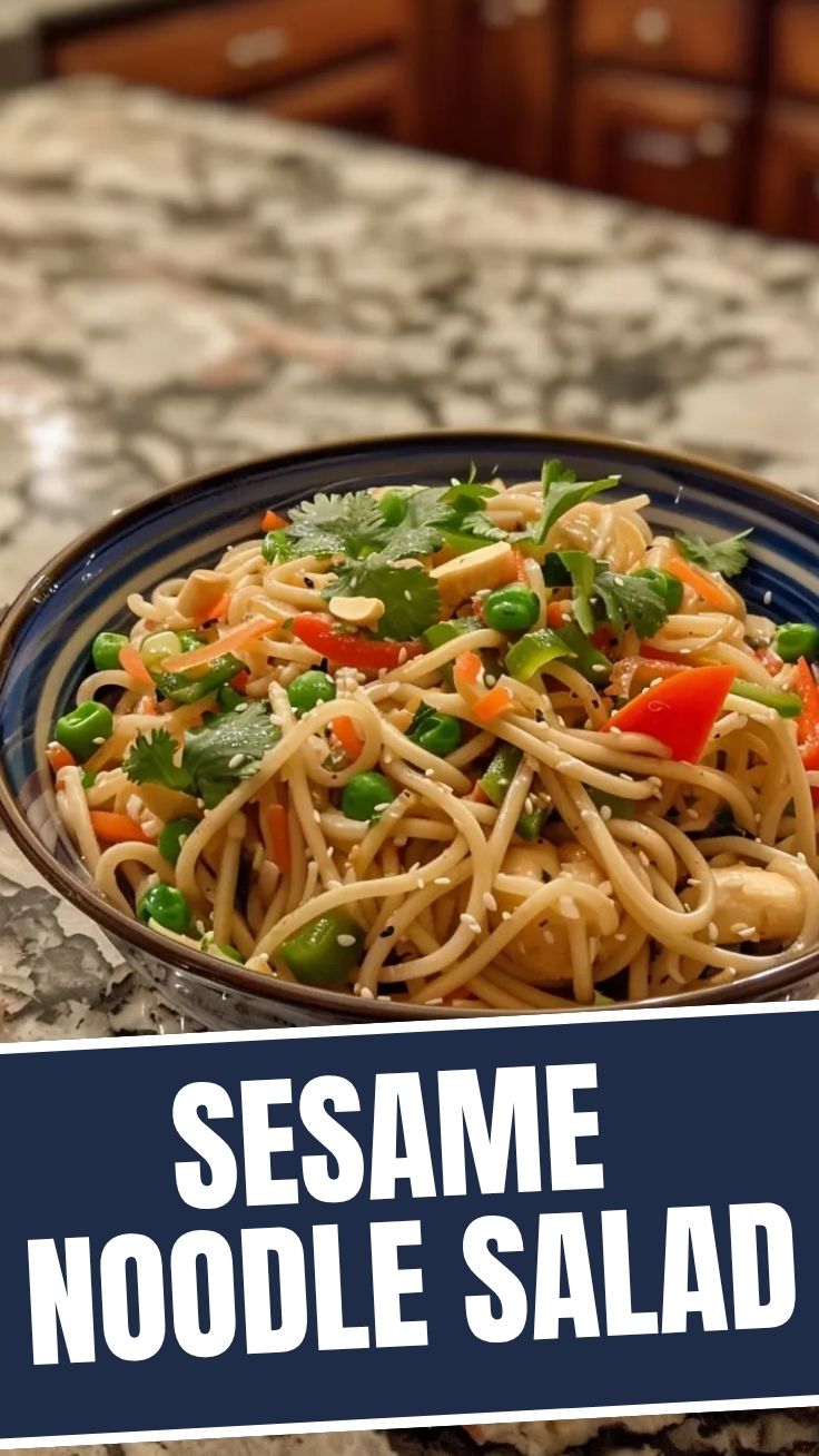 A vibrant cold noodle salad, Asian-style, with fresh vegetables and sesame seeds.