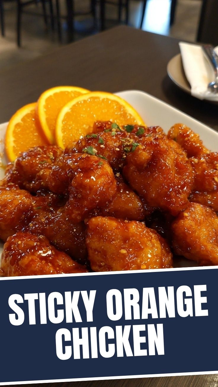 A portion of Orange Chicken (Panda Express Style) with a glossy sauce and garnished with green onions