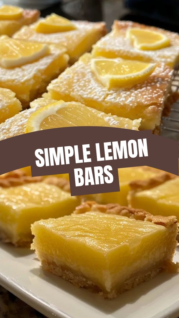 A platter of golden lemon bars with a dusting of powdered sugar.