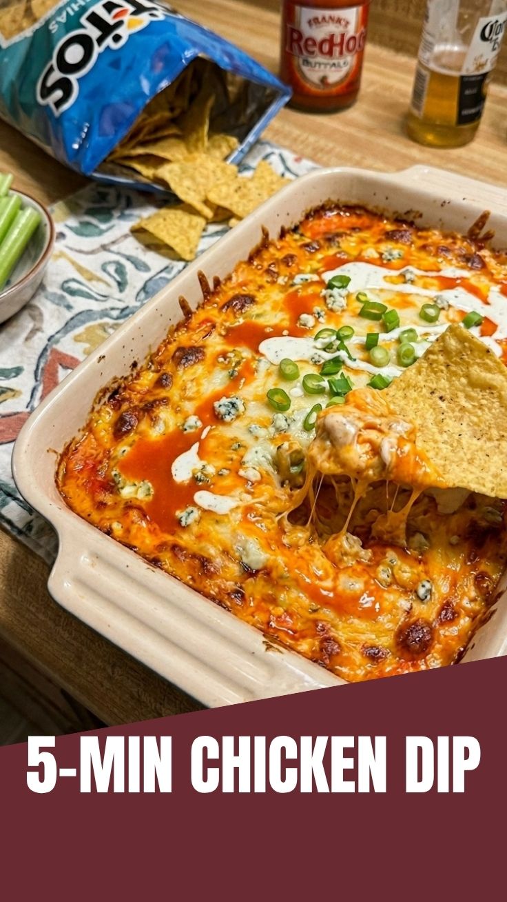 A hot and cheesy buffalo chicken dip in a baking dish, ready to serve.