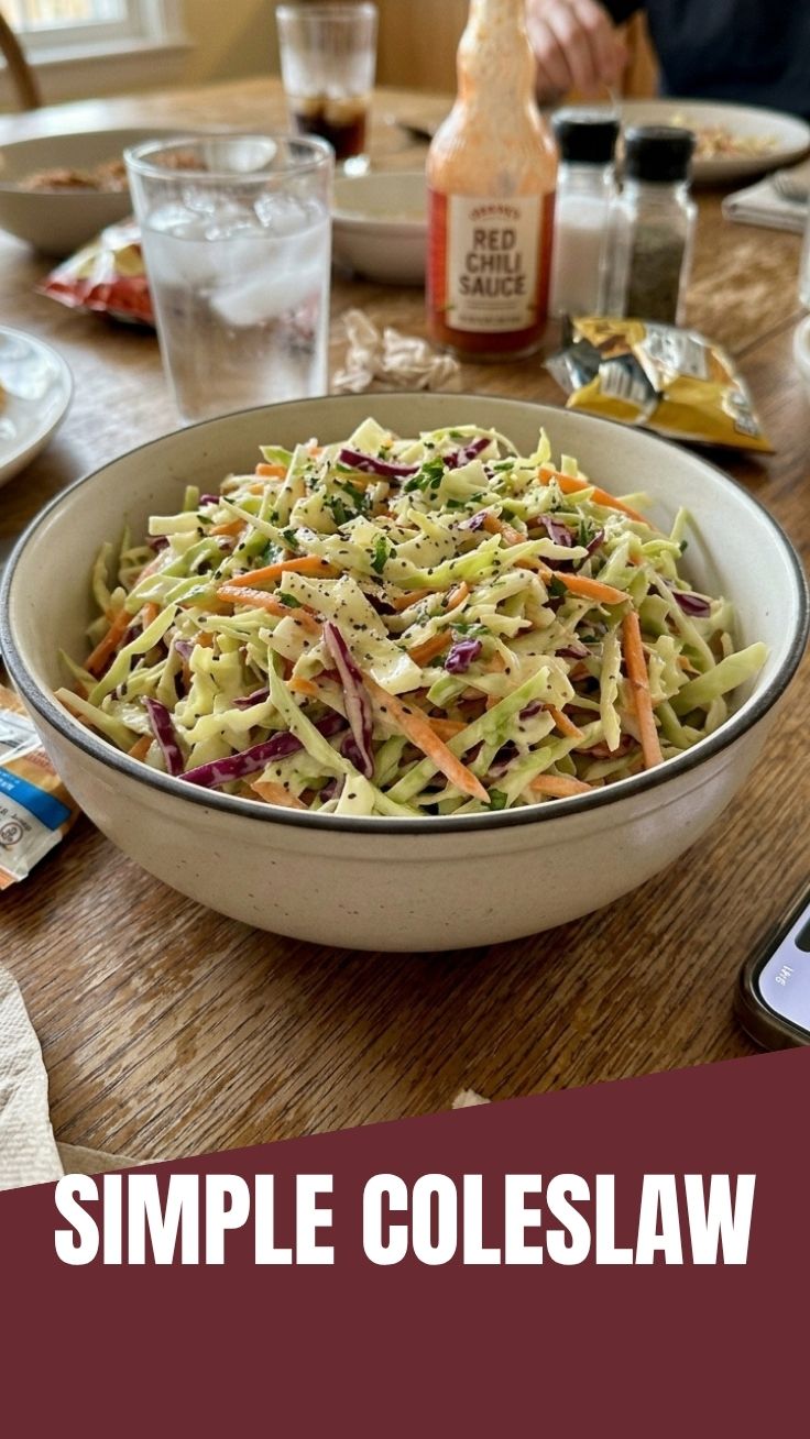 A vibrant bowl of fresh coleslaw made with shredded cabbage and carrots