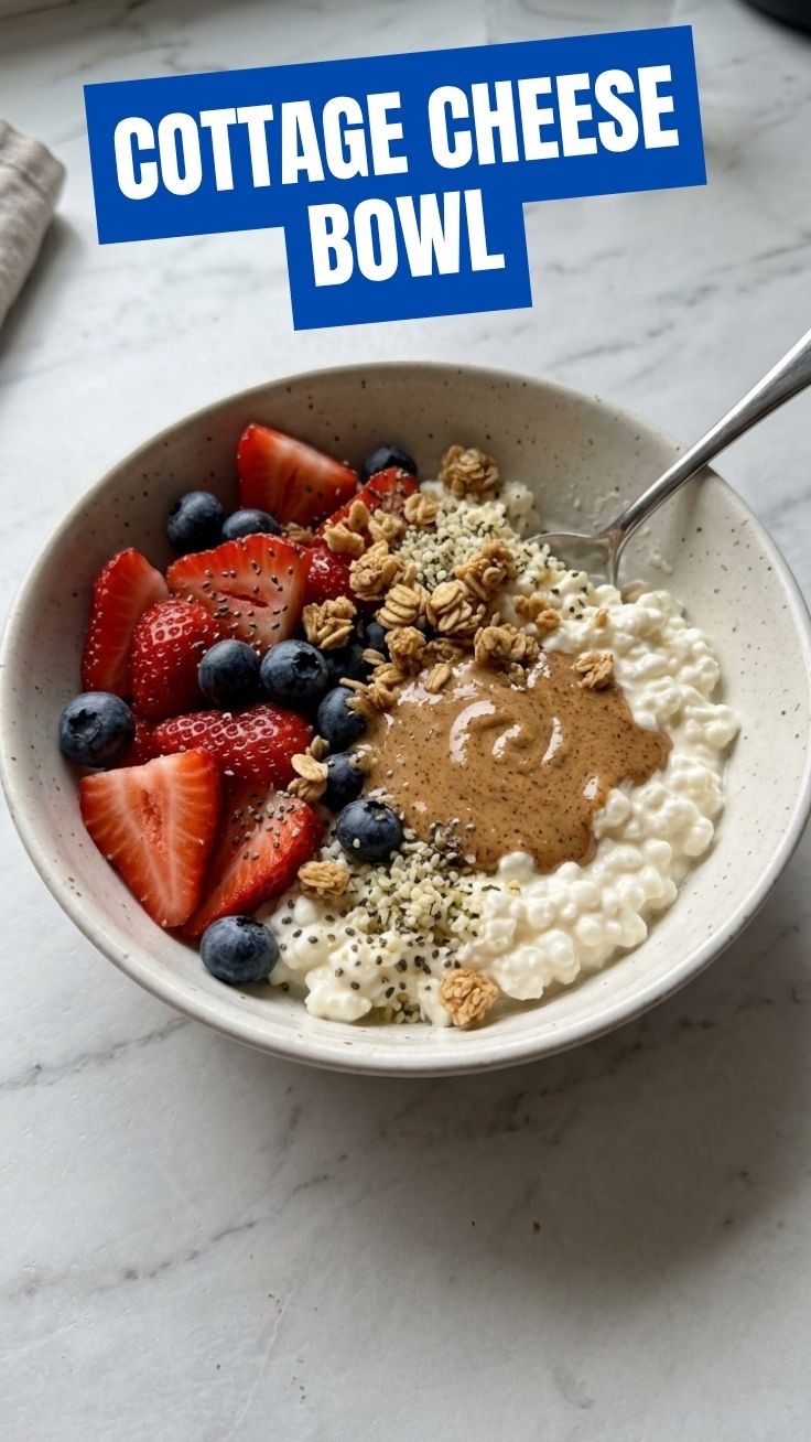 A colorful high protein cottage cheese bowl topped with fresh fruit and nuts for a healthy breakfast.