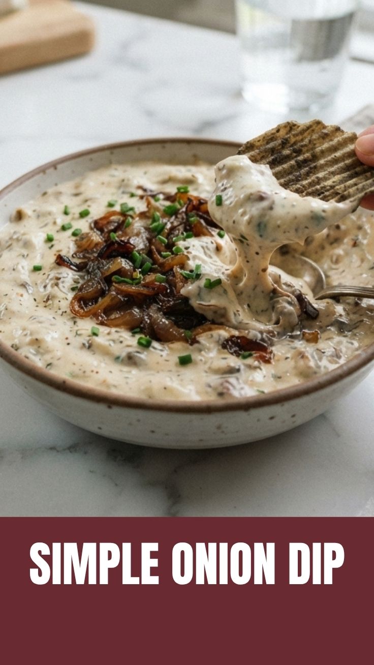 French Onion Dip in a serving bowl with caramelized onions on top
